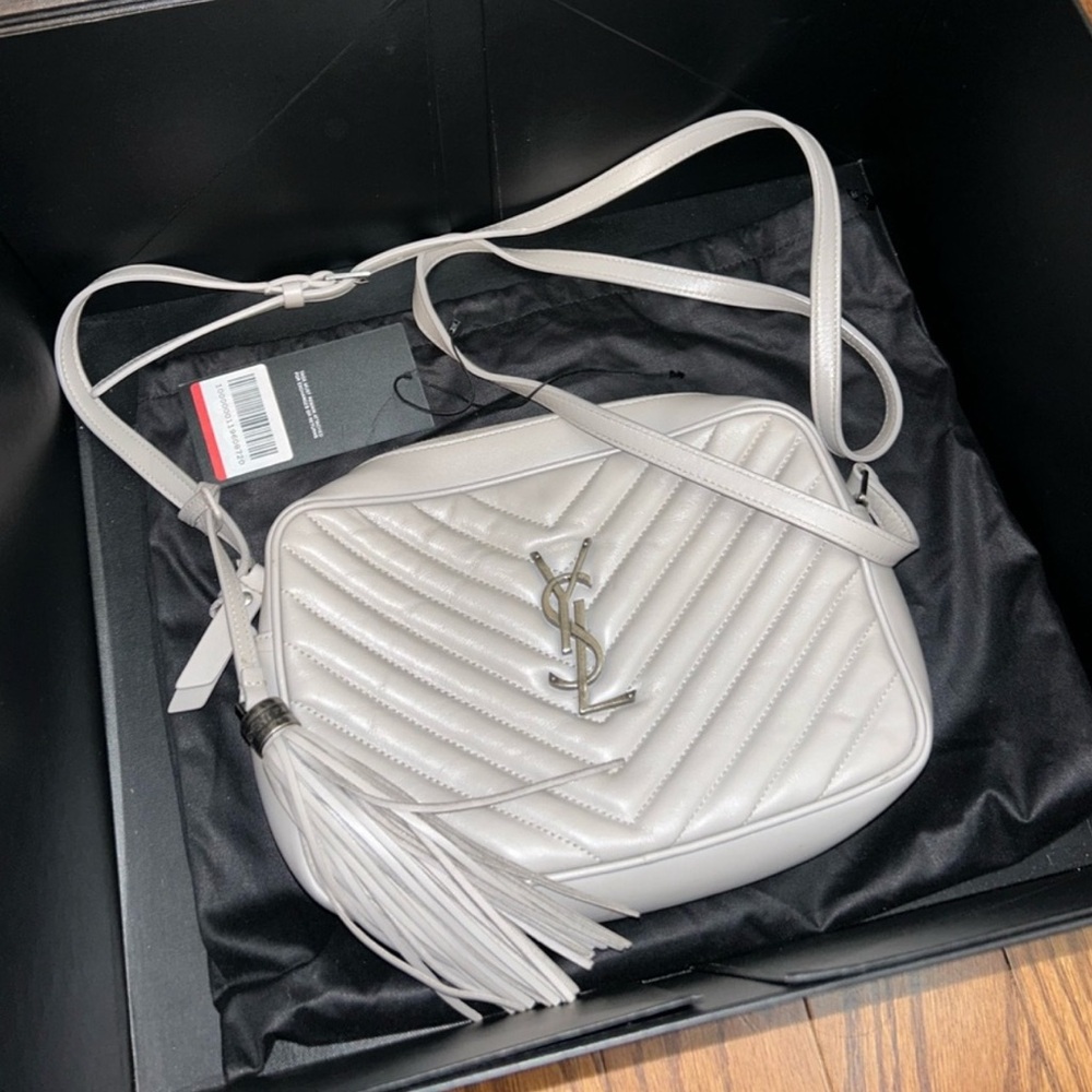 Authentic gray YSL Crossbody with tassel keychain.